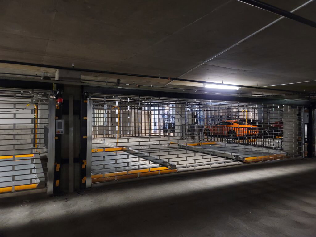 Tandem parking stacker system installed for compact vehicle storage